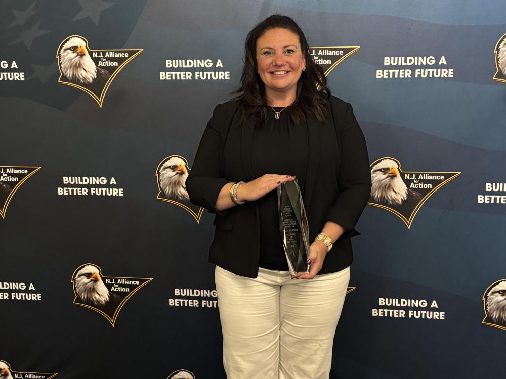 woman holding an award