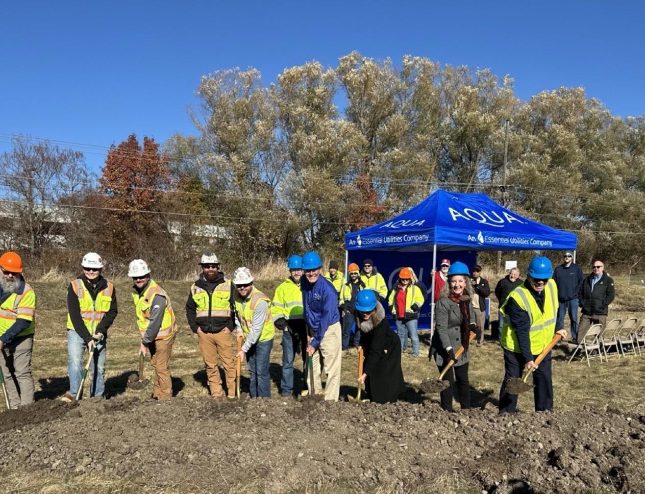 group of people breaking ground