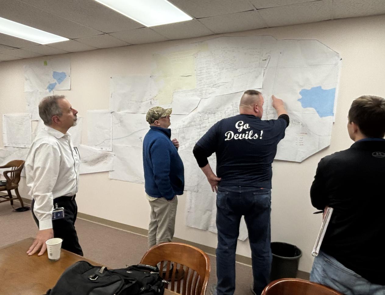 people looking at maps